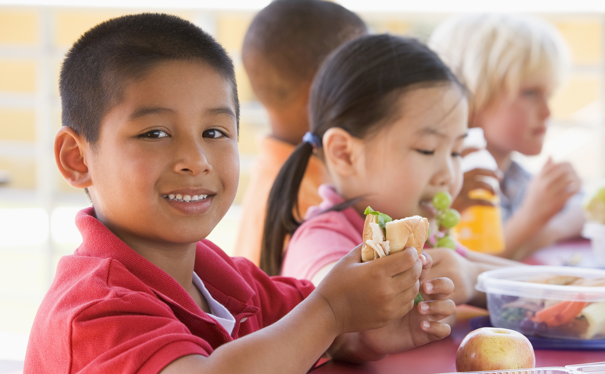 kindergarten children eating lunch